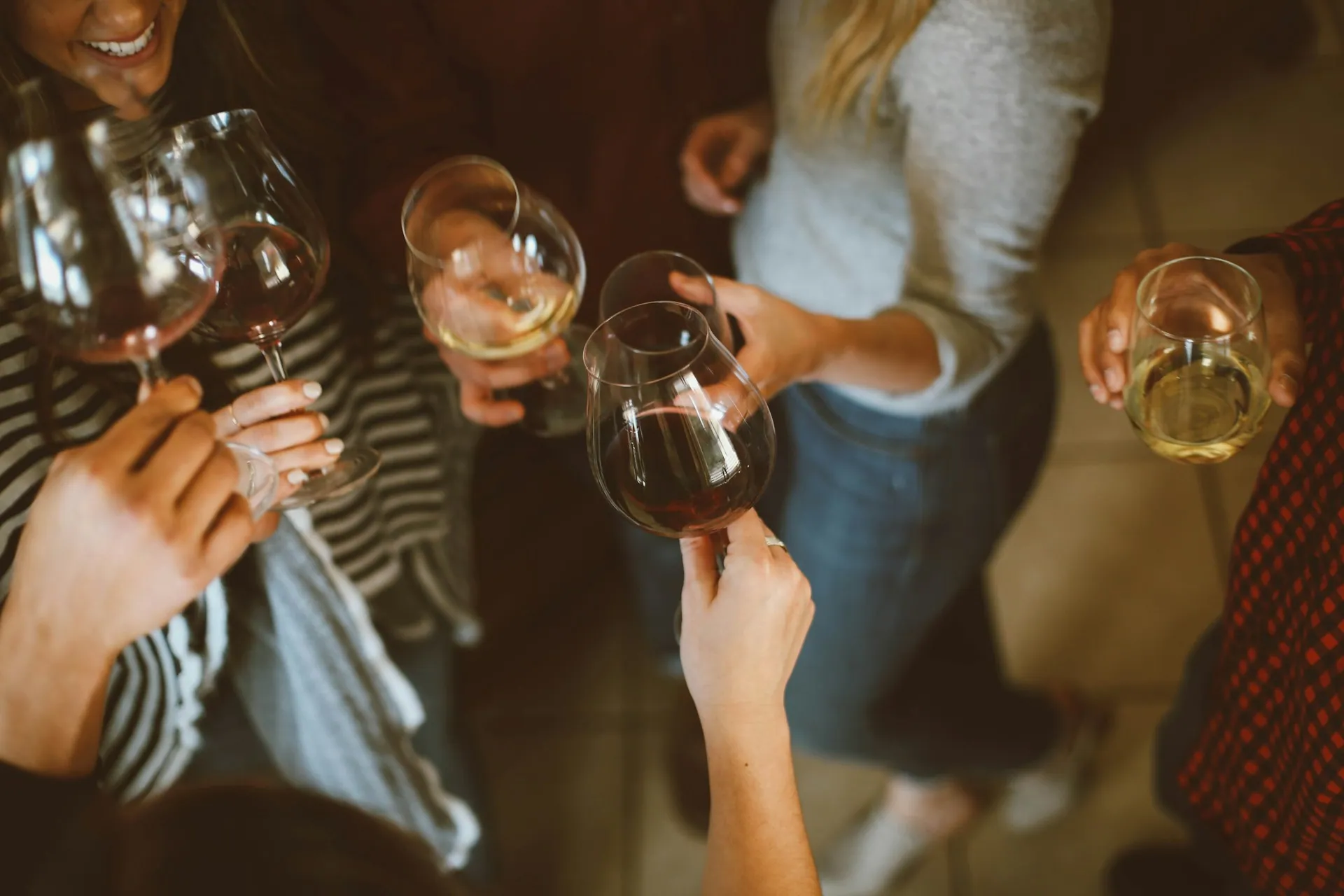 Guests raising glasses together at a drinks reception