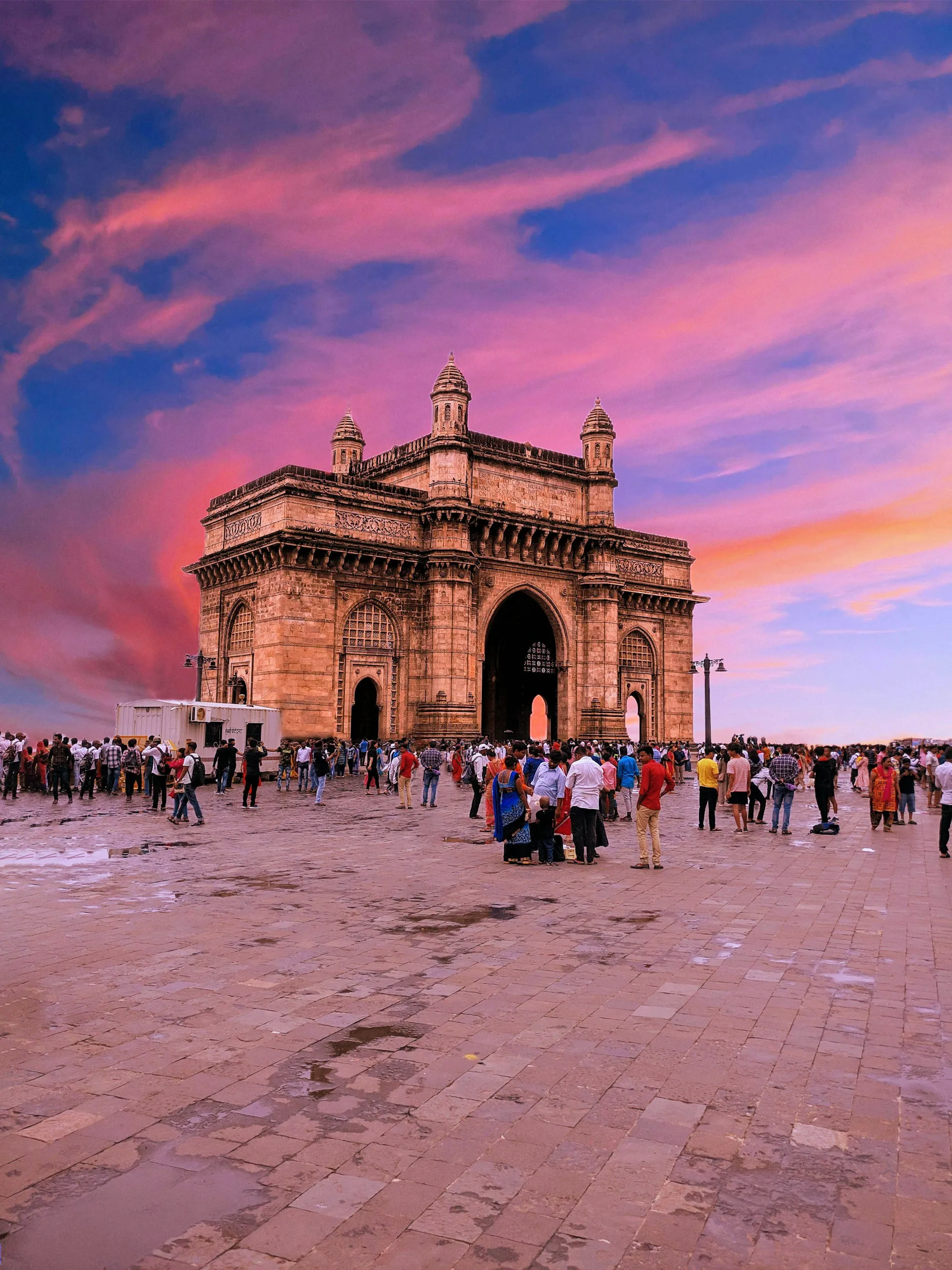 The Gateway of India in Mumbai with crowds gathered in front of it
