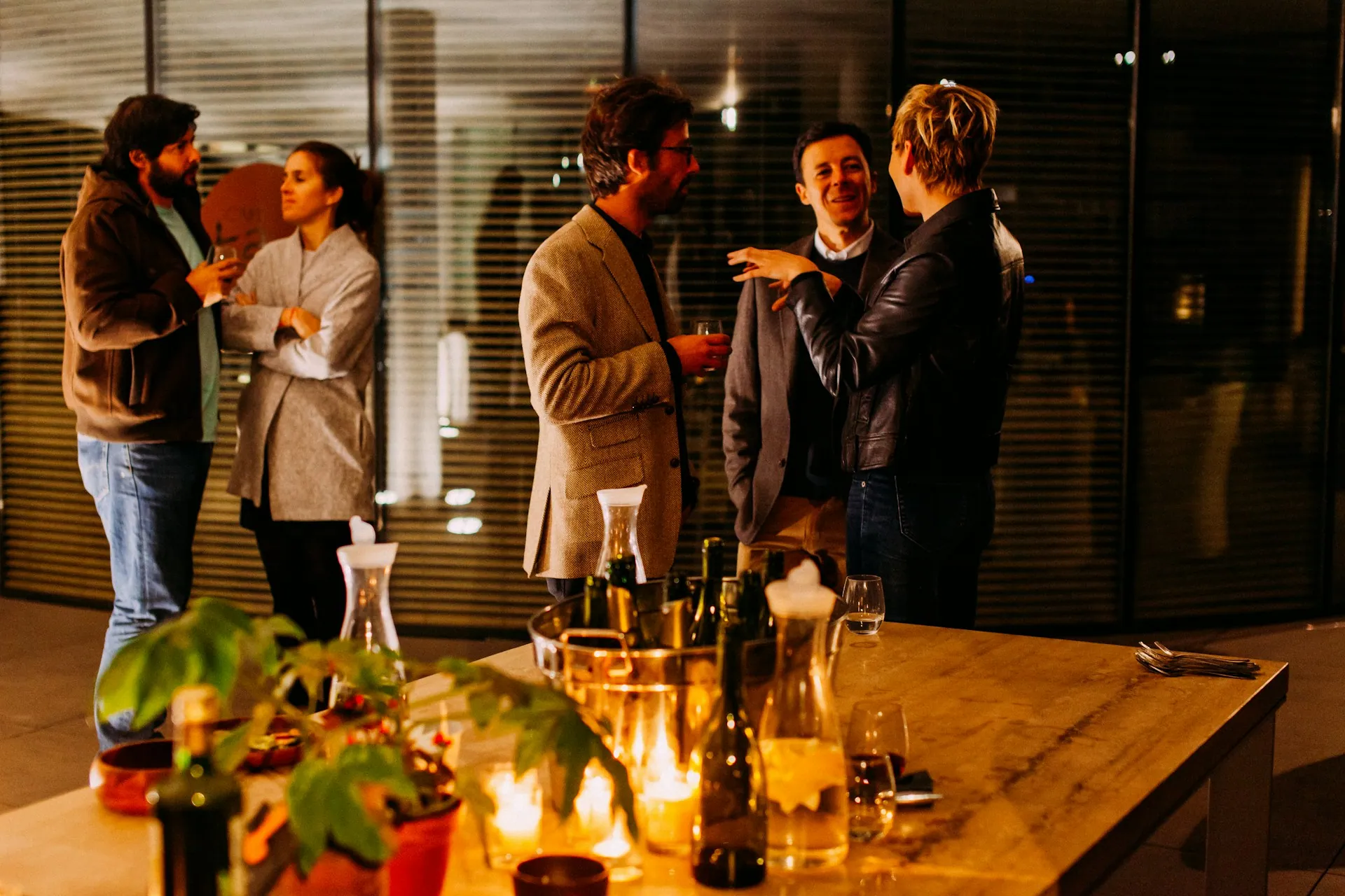Business guests talking over drinks at a networking reception