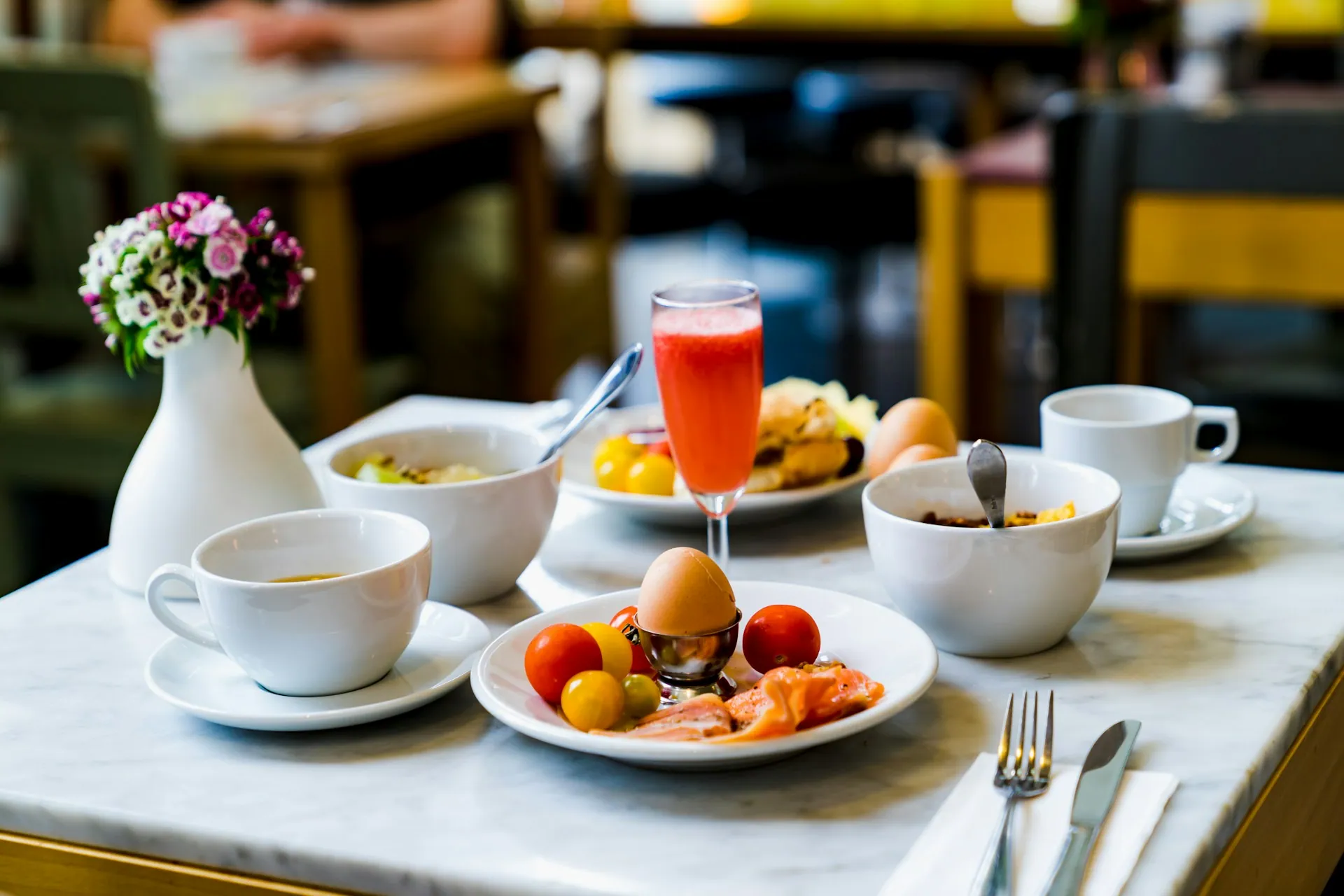A table laid with drinks and small plates for a tasting showcase